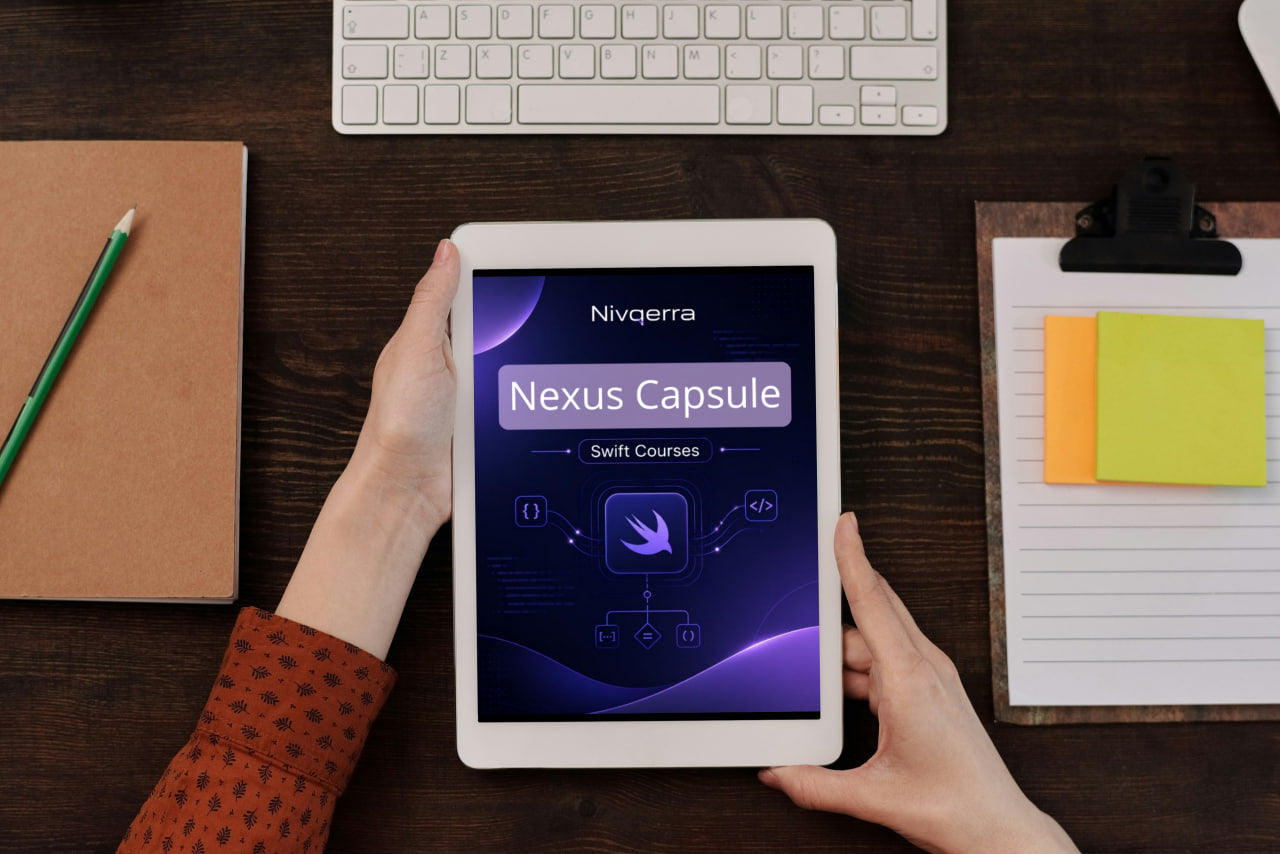 Person holding a tablet displaying Nivverra Nexus Capsule on a desk with a keyboard and stationery items.